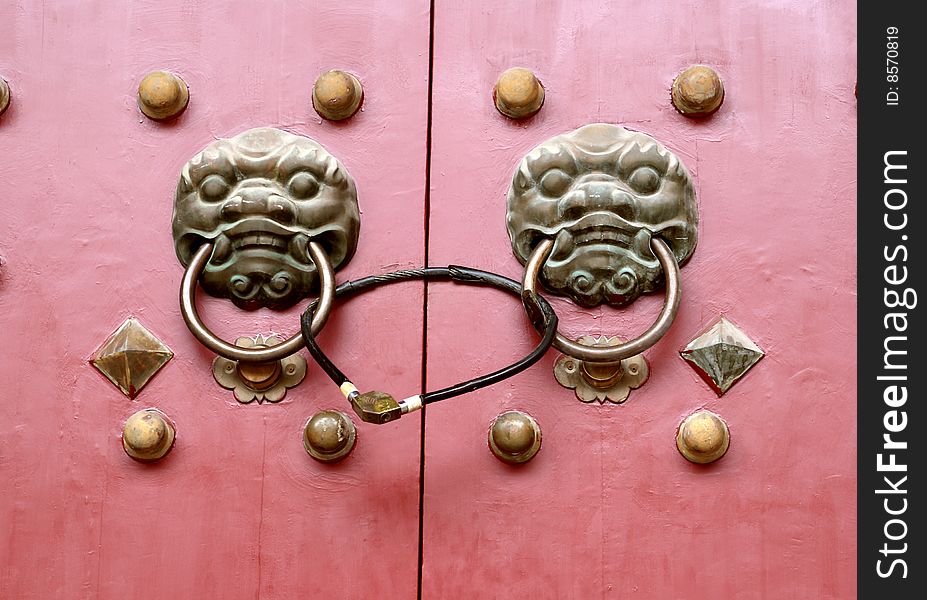 Chinese temple door with lion knob. Chinese temple door with lion knob