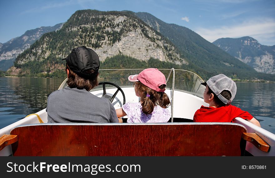 Mother With 2 Kids In A Boat