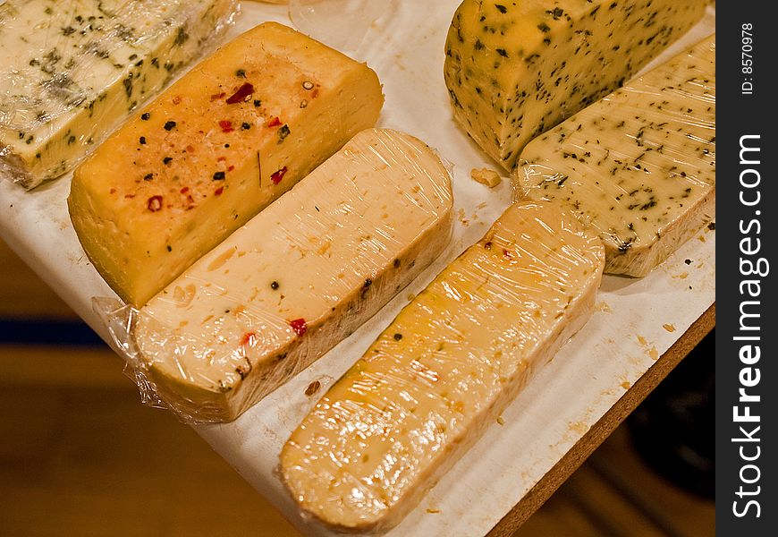 Display of variety of different healthy cheese products. Display of variety of different healthy cheese products