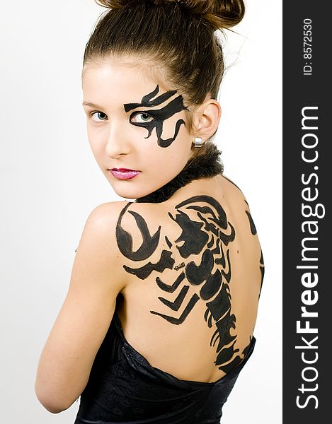 Girl with scorpio painted on back