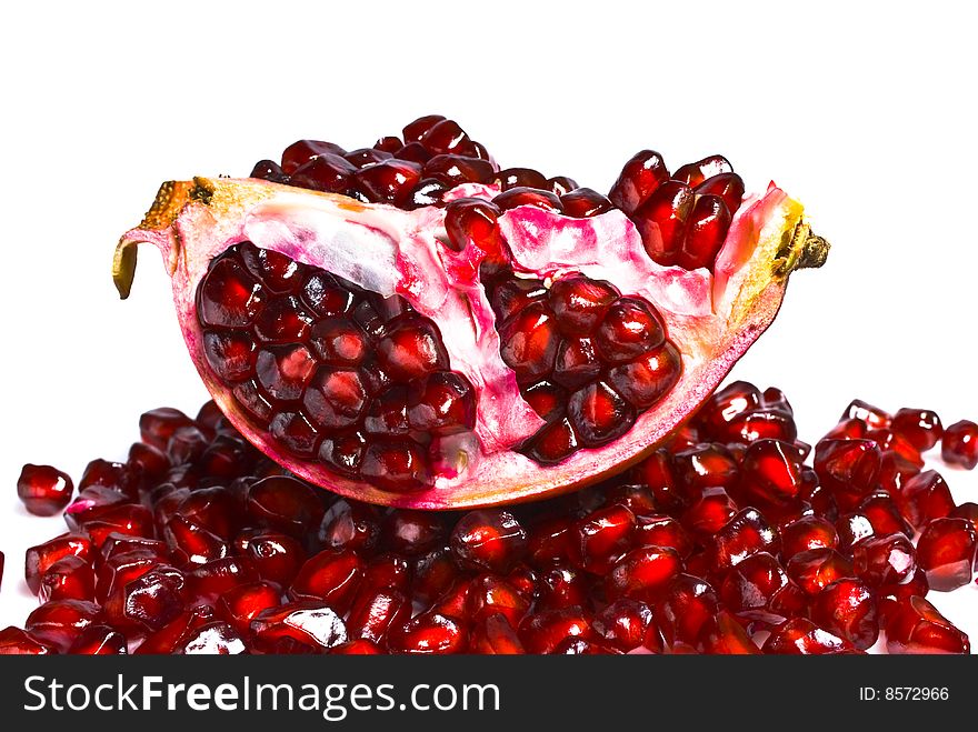 Juicy pomegranate on a white background