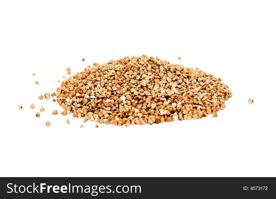 Uncooked buckwheat isolated on white background