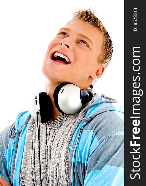 Man with headphones around his neck on an isolated white background