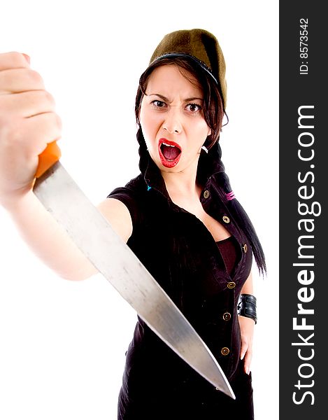Young fashionable female wearing army cap and defending herself on an isolated white background