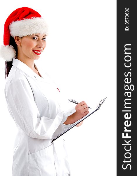 Smart doctor wearing christmas hat and holding clipboard isolated on white background