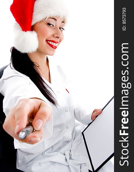 Young doctor wearing christmas hat on white background