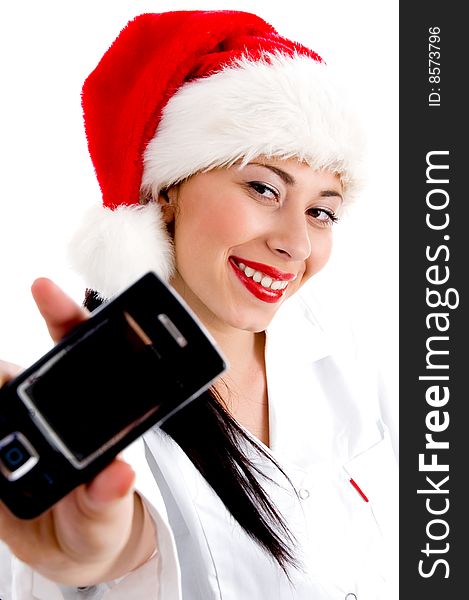 Woman wearing christmas hat and showing mobile against white background