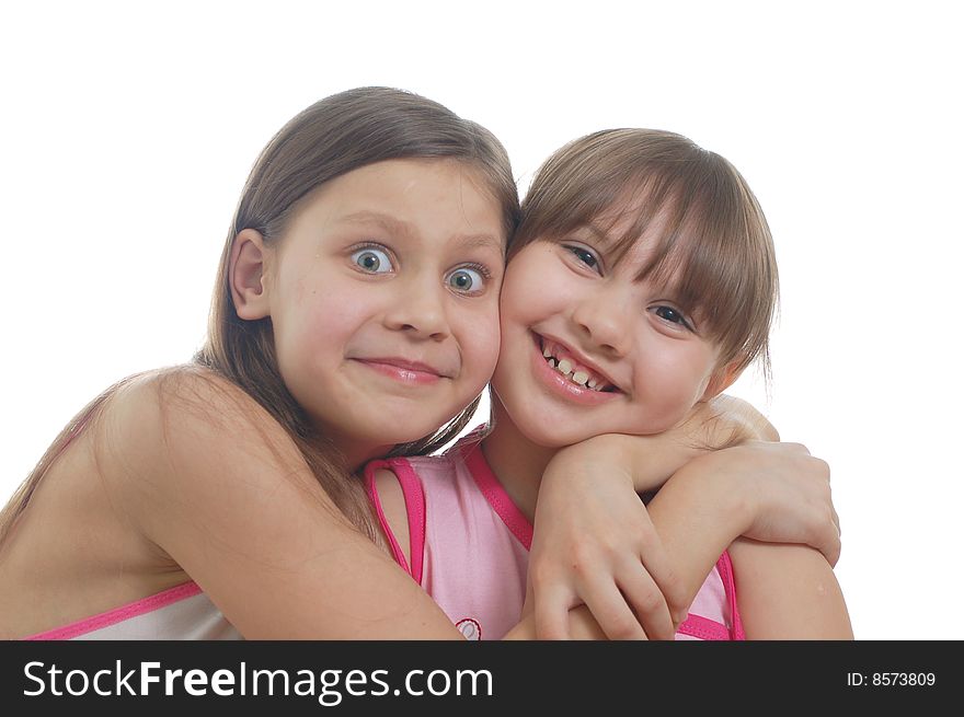 Two young girls isolated on the white background. Two young girls isolated on the white background