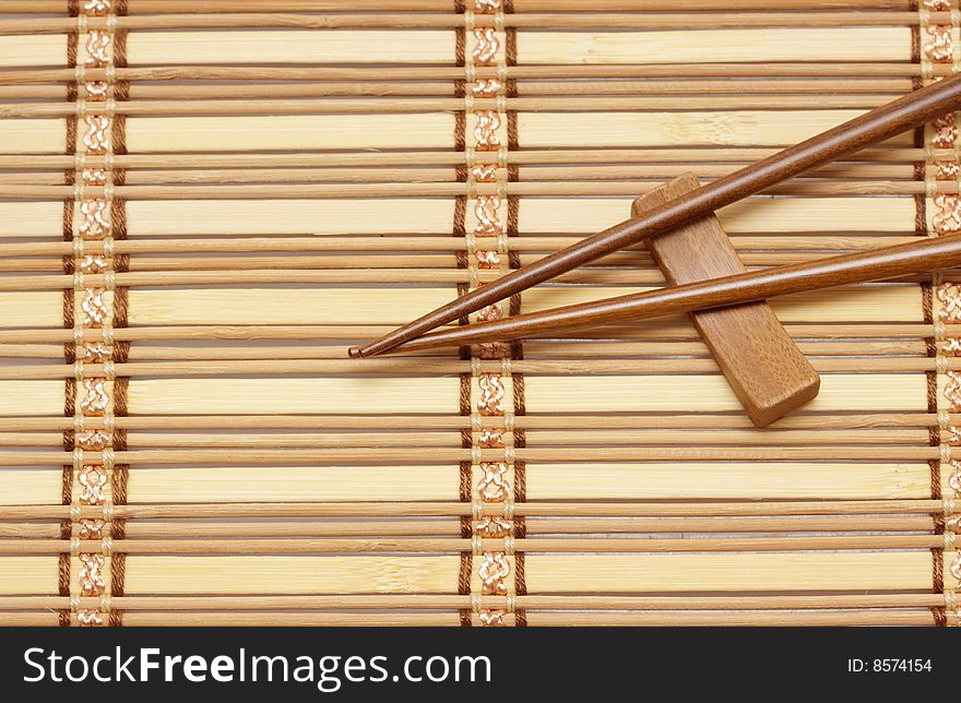 Wooden mat and eating sticks