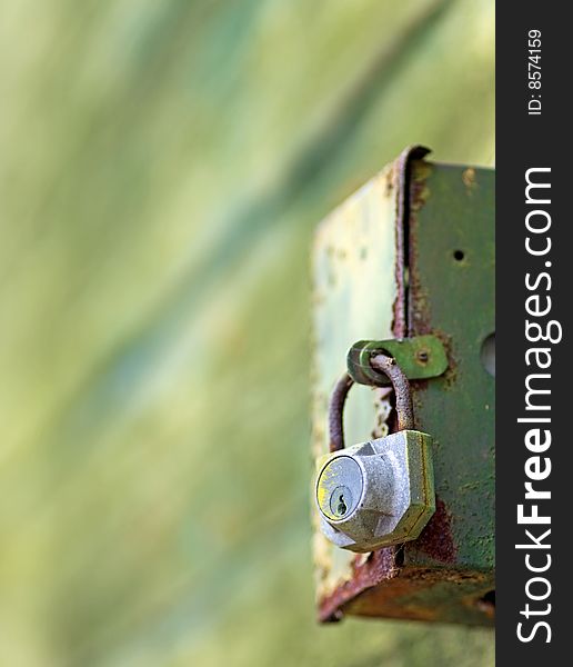 Locked rusted box on abstract background. Locked rusted box on abstract background