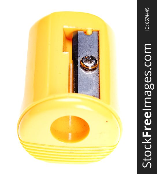 Plastic pencil sharpener. Yellow color. Isolated on the white background.