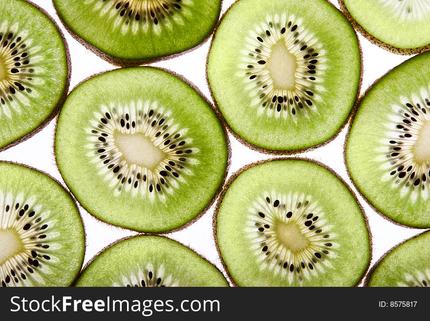 Fresh kiwi slices isolated on white background