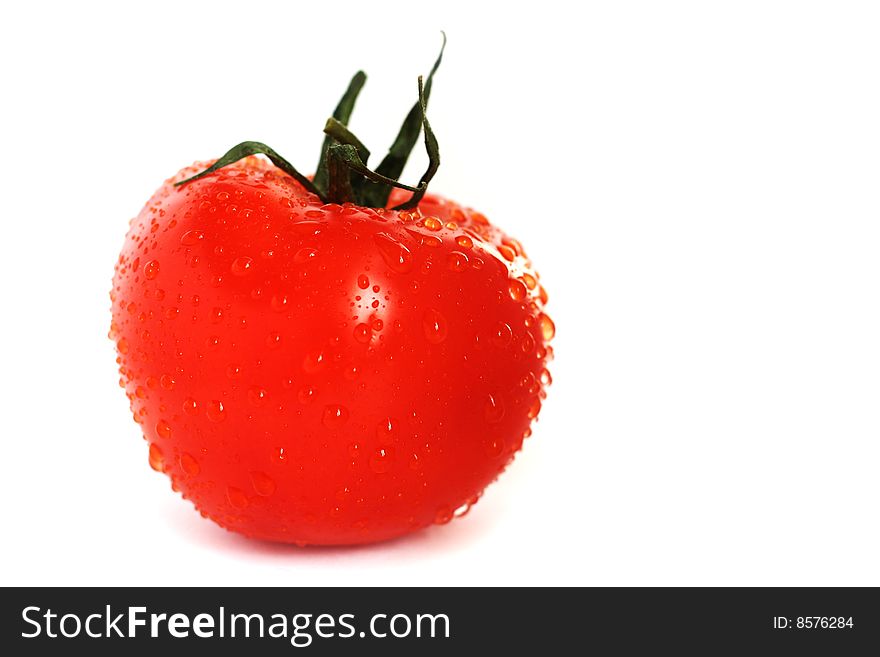 Red fresh tomato on white