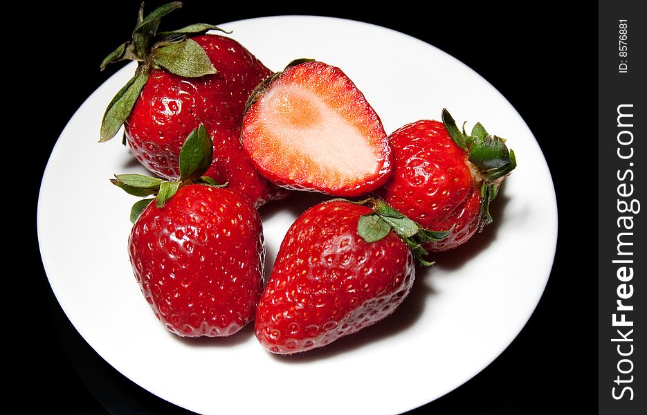Ripe strawberry on a plate