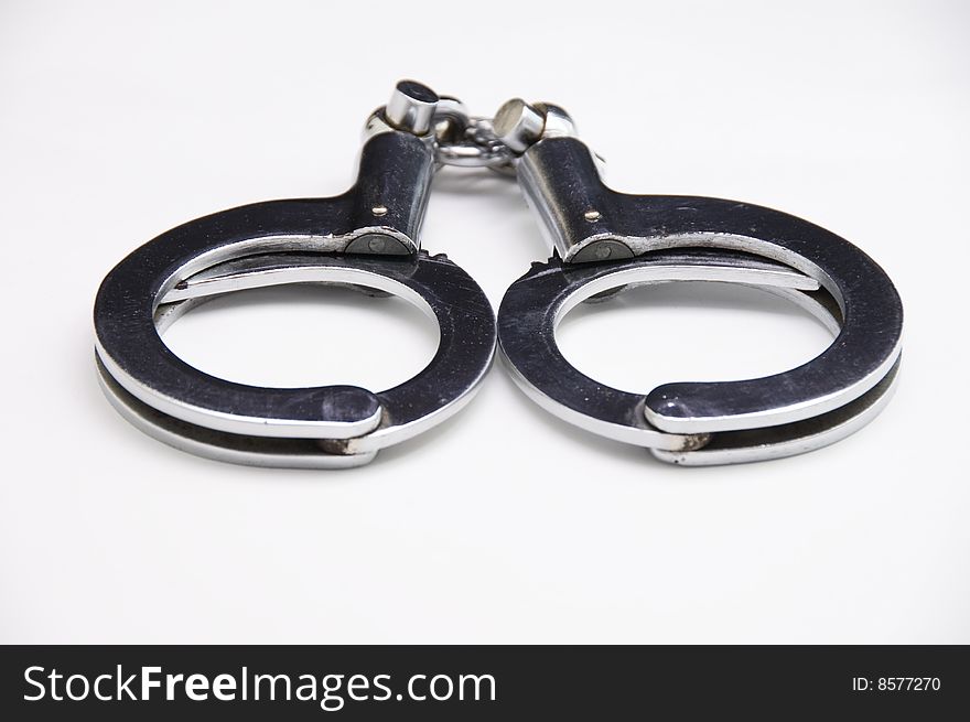 A close-up of handcuff with white background.