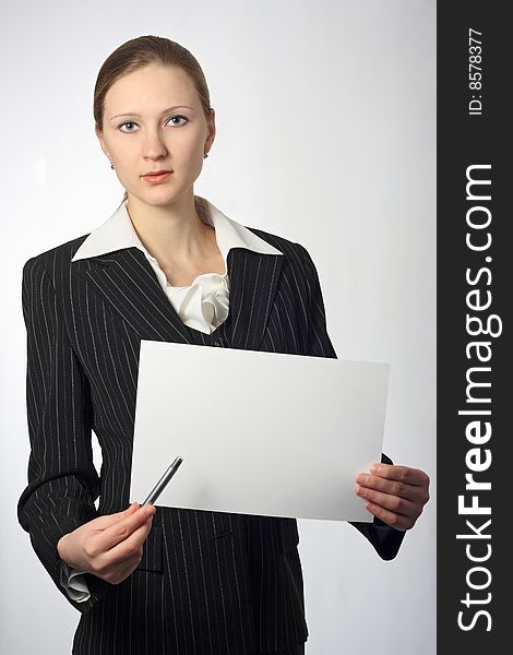 Young Beautiful Businesswoman With Sheet And Pen