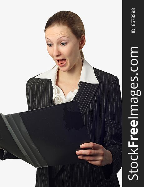Beautiful businesswoman open-mouthed with surprise looking on folder