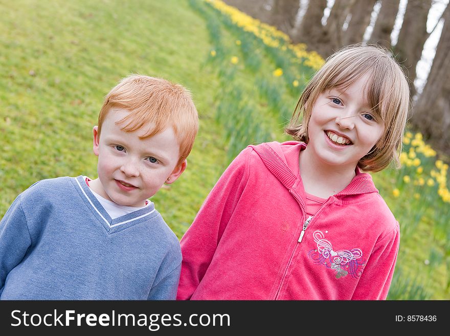 Brother and sister in park