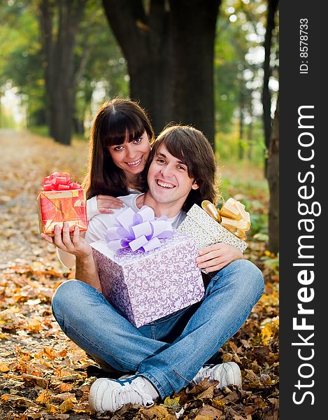 Young Couple With Gift Boxes