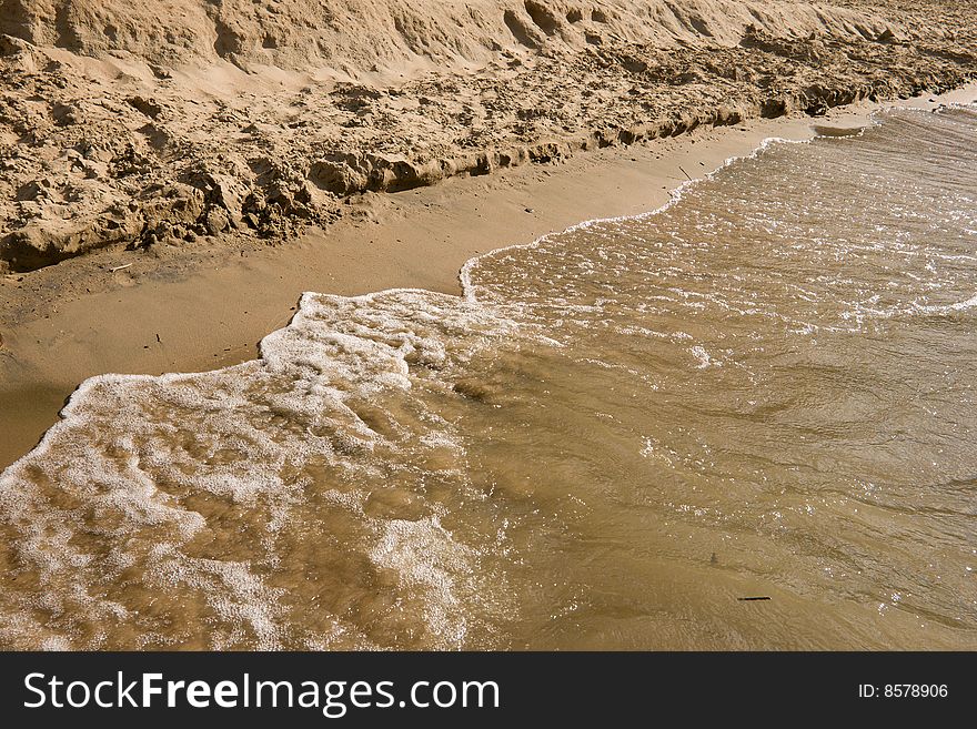 Wet send background on the beach