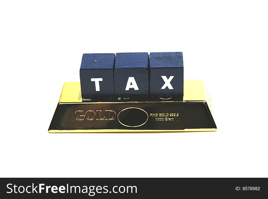 The word tax on top of a bar of gold