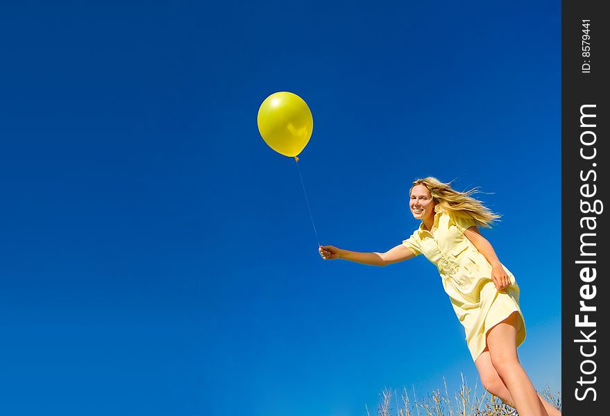 A girl with yellow balloon. A girl with yellow balloon