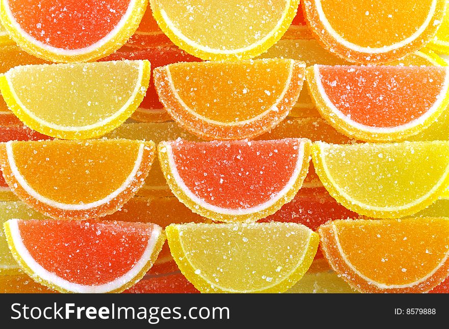 Four rows of colorful  fruit jellies. Four rows of colorful  fruit jellies