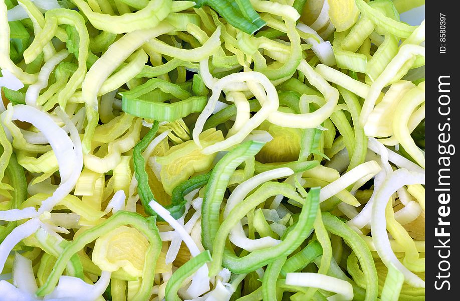 Green vitamin sliced onion salad background (macro)