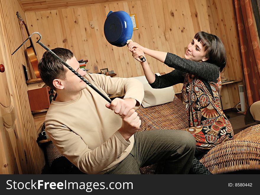 Young man in jocular conflict with woman. Young man in jocular conflict with woman