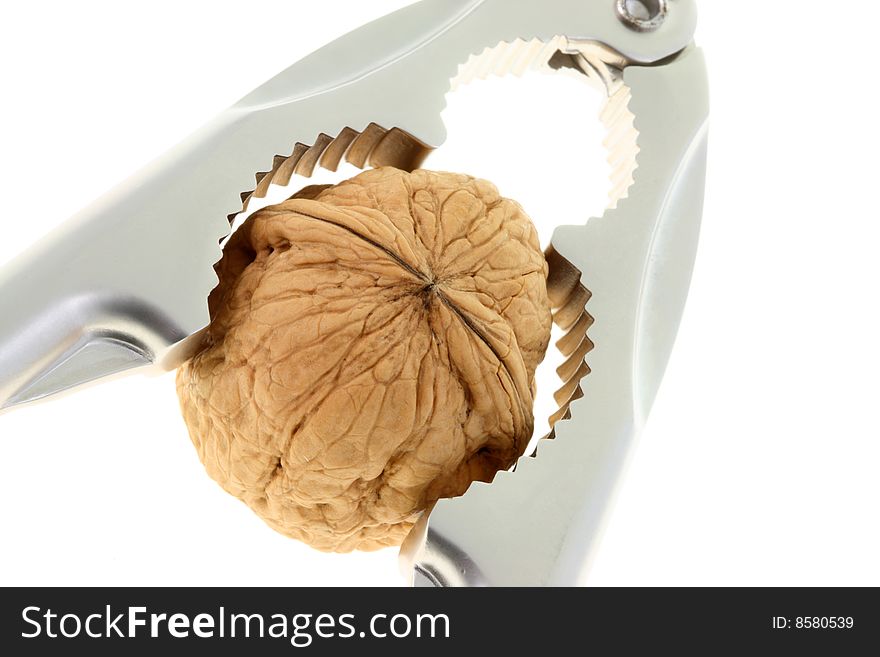 Nutcracker and walnut on a white background. Nutcracker and walnut on a white background.