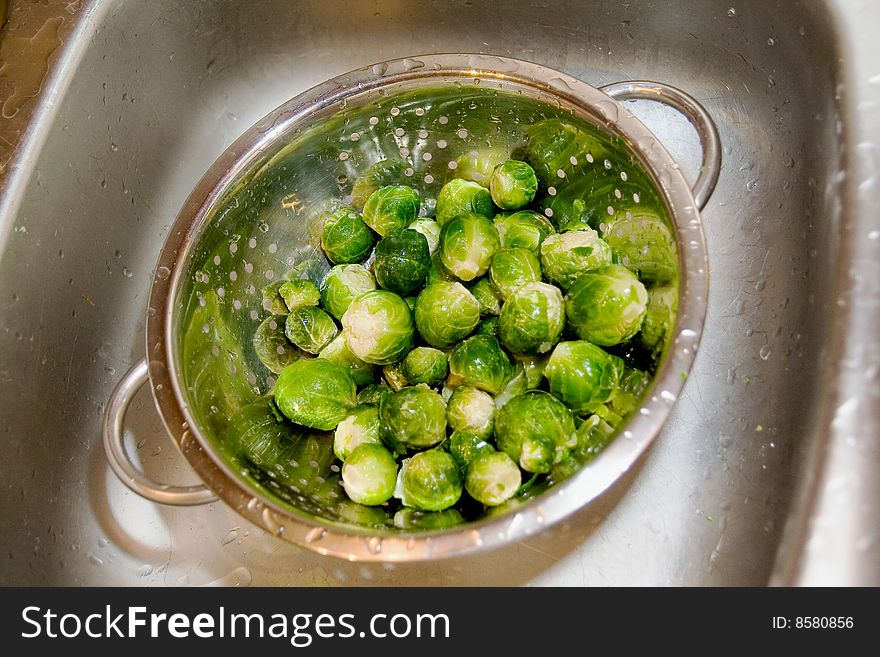 Brussel sprout in silver strainer