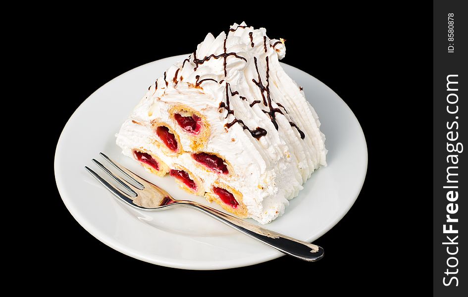 Piece of fancy cherry pyramid tart on plate, isolated on black. Piece of fancy cherry pyramid tart on plate, isolated on black