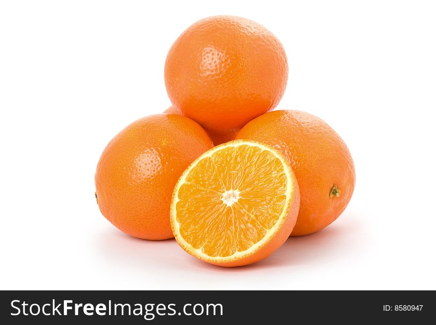 Many oranges are in a heap. Many oranges are in a heap