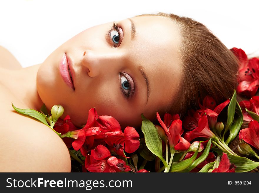 Laying beautiful  young woman with flowers. Laying beautiful  young woman with flowers
