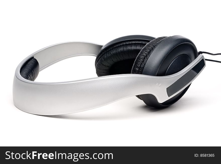A set of silver and black audio headphones on white