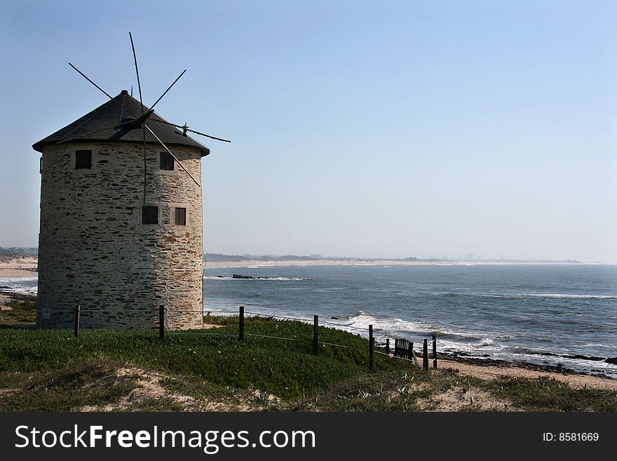 Old windmill on a sunny coast