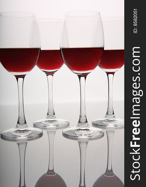 Glasses of red wine with reflections. Glasses of red wine with reflections