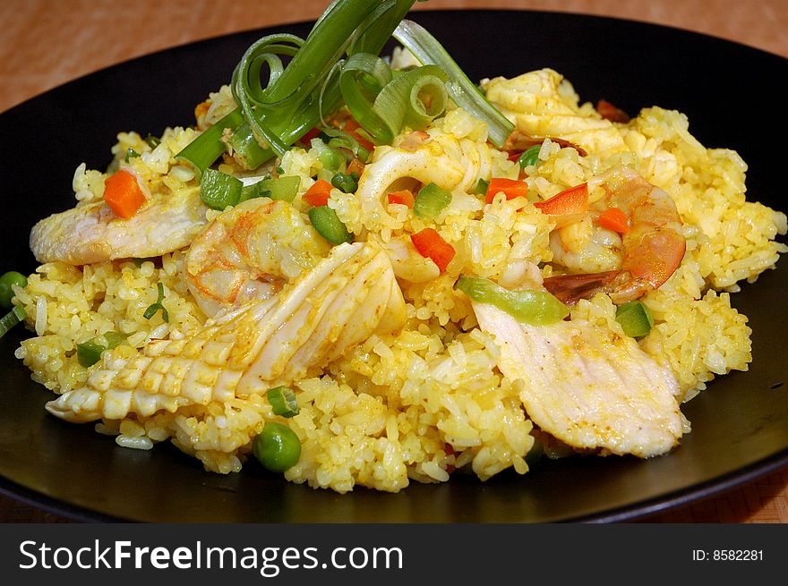 Seafood and chicken stir fry rice with vegetables