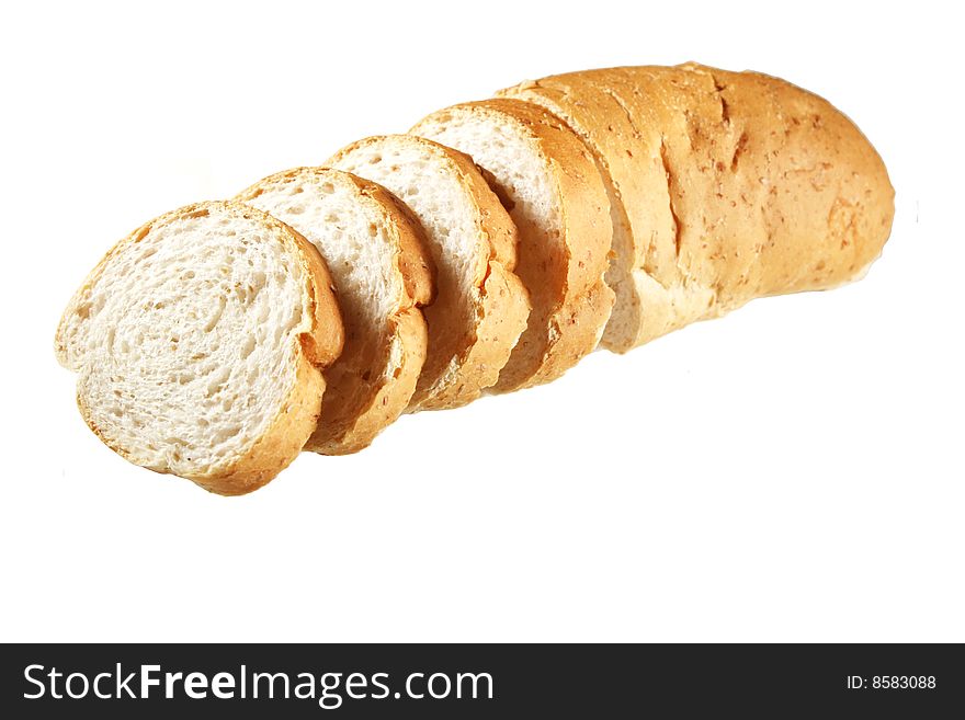An image of a partially sliced loaf of bread. An image of a partially sliced loaf of bread