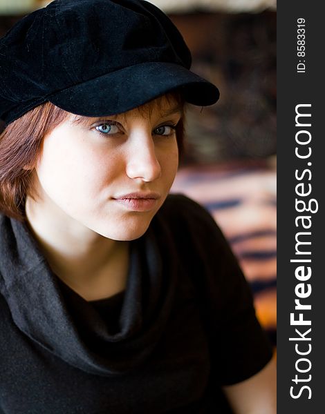 Beautiful girl in a stylish black cap. Beautiful girl in a stylish black cap