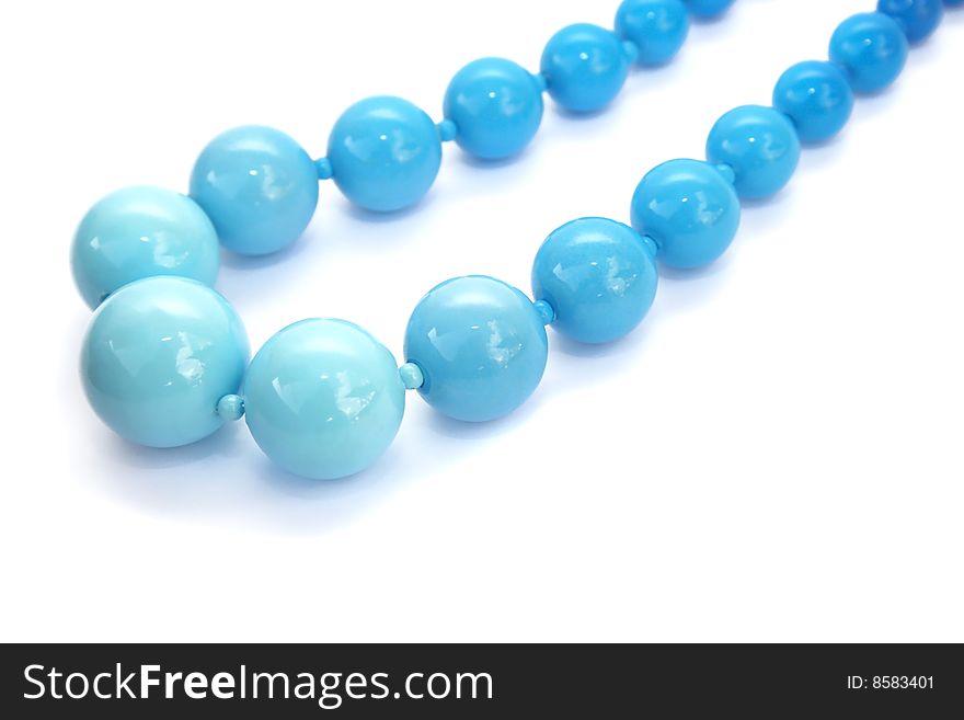 Blue beads necklace isolated on white background.