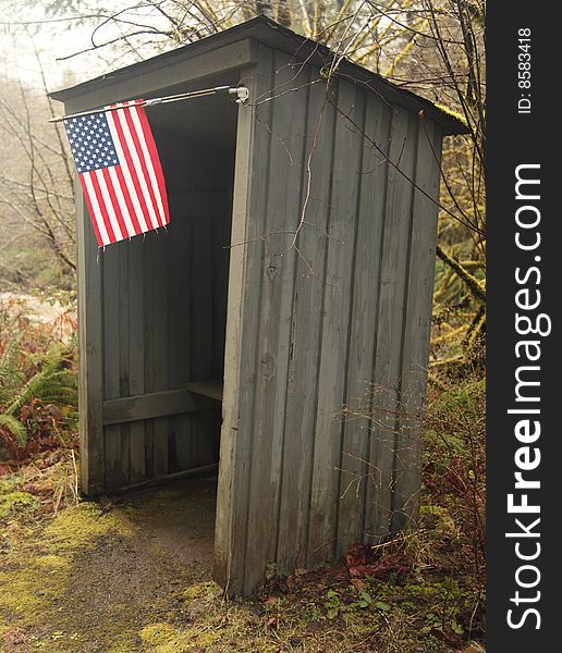 Rural bus shelter with american flag out in a nature rural landscape. Rural bus shelter with american flag out in a nature rural landscape