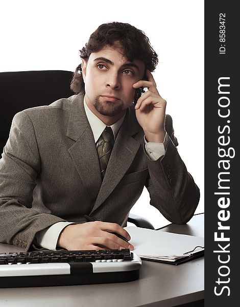 Business theme: handsome businessman in a work process. Business theme: handsome businessman in a work process.