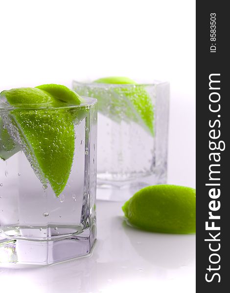 Glass of water with lime slices