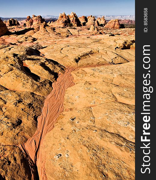 A tiny dry creekbed drains towards the South Coyote Buttes in northern Arizona