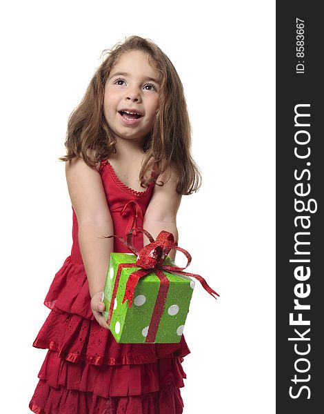 Young child holding a present with a gleeful smile. Young child holding a present with a gleeful smile.