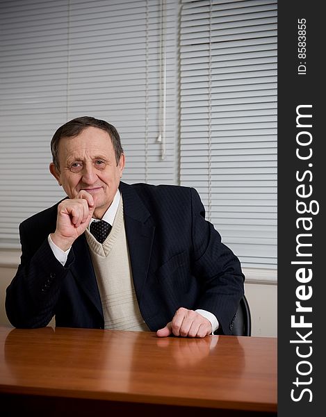 Portrait of a senior businessman sitting at office