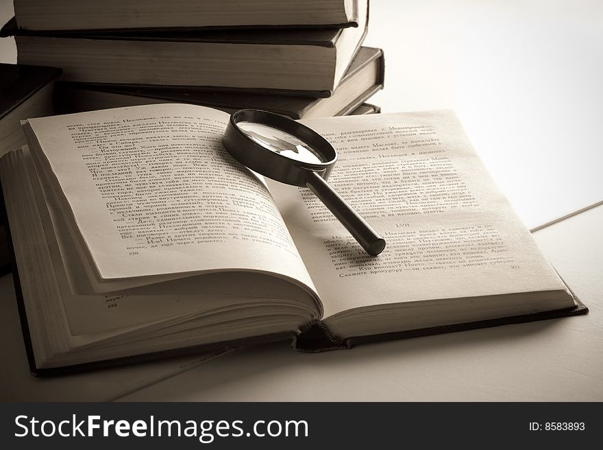 Books on the table. Isolated over black background