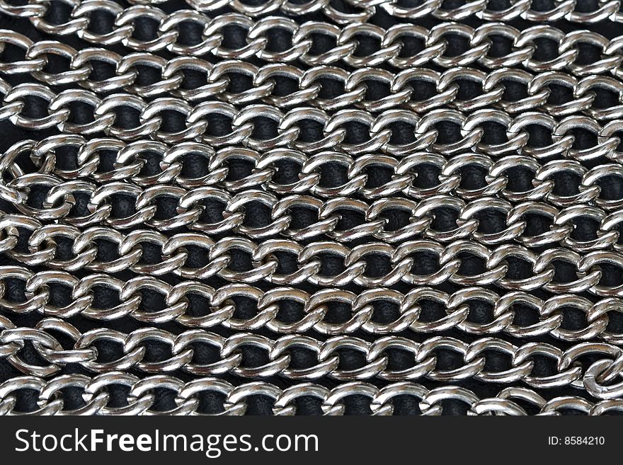 Background made from steel chains lying on dark. Background made from steel chains lying on dark