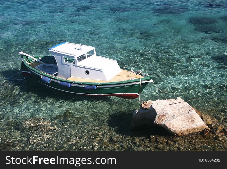 Small boat and clear sea in Sardinia. Small boat and clear sea in Sardinia